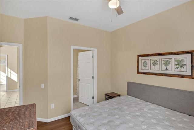 8113 Sun Palm Dr, Kissimmee, FL 34747 - bedroom with wood finished floors, baseboards, and ceiling fan