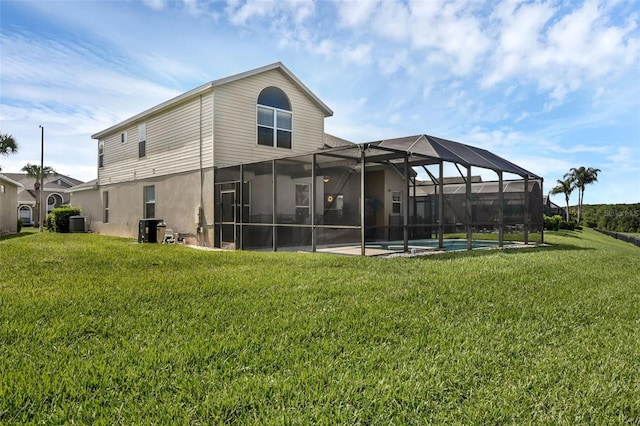 8113 Sun Palm Dr, Kissimmee, FL 34747 - rear view of house featuring central air condition unit, a lawn, a lanai, and an outdoor pool