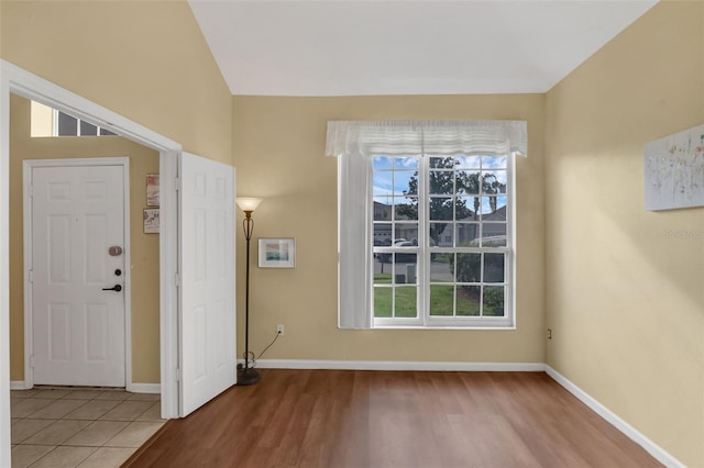 8113 Sun Palm Dr, Kissimmee, FL 34747 - entrance foyer with healthy amount of natural light, baseboards, and light wood-style floors
