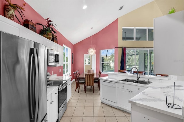 8113 Sun Palm Dr, Kissimmee, FL 34747 - kitchen featuring appliances with stainless steel finishes, a sink, light countertops, a chandelier, and white cabinetry