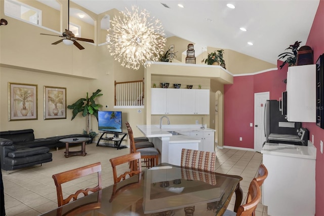 8113 Sun Palm Dr, Kissimmee, FL 34747 - dining room with high vaulted ceiling, light tile patterned floors, a ceiling fan, a chandelier, and recessed lighting