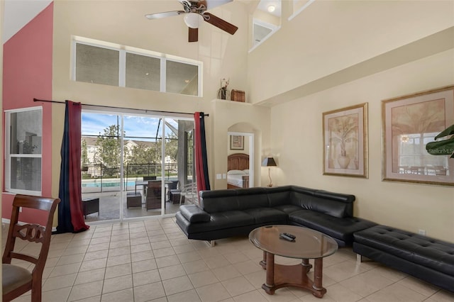 8113 Sun Palm Dr, Kissimmee, FL 34747 - living area featuring a towering ceiling, a ceiling fan, light tile patterned floors, and a sunroom