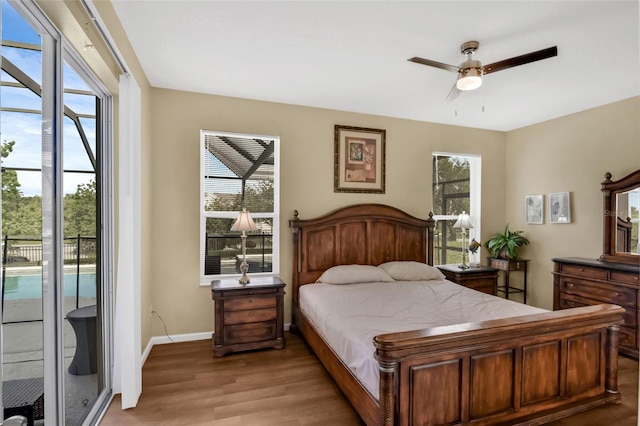 8113 Sun Palm Dr, Kissimmee, FL 34747 - bedroom with access to exterior, light wood-style flooring, baseboards, and a ceiling fan