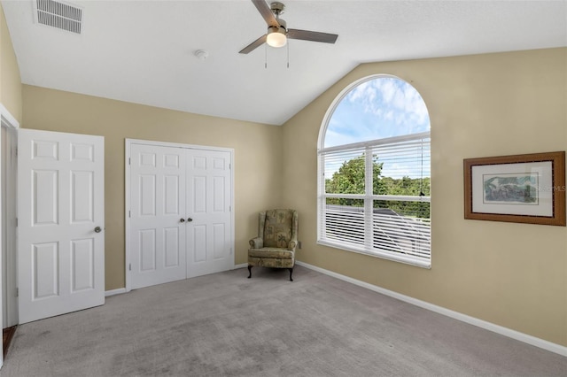 8113 Sun Palm Dr, Kissimmee, FL 34747 - living area with ceiling fan, carpet, vaulted ceiling, and baseboards