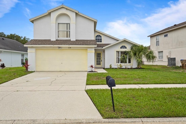 3018 Bransbury Ct, Kissimmee, FL 34747 - view of front of property with stucco siding, a front lawn, concrete driveway, and a garage