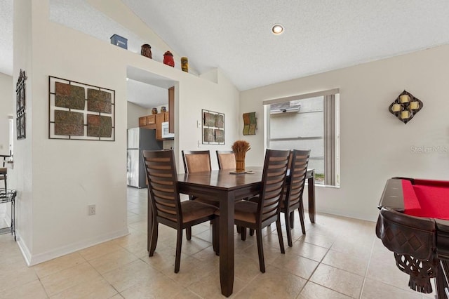 3018 Bransbury Ct, Kissimmee, FL 34747 - dining space featuring lofted ceiling, light tile patterned floors, baseboards, a textured ceiling, and recessed lighting