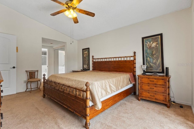 3018 Bransbury Ct, Kissimmee, FL 34747 - bedroom with light carpet, lofted ceiling, ceiling fan, baseboards, and ensuite bath