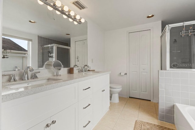 3018 Bransbury Ct, Kissimmee, FL 34747 - full bath featuring double vanity, a stall shower, tile patterned flooring, a bath, and toilet