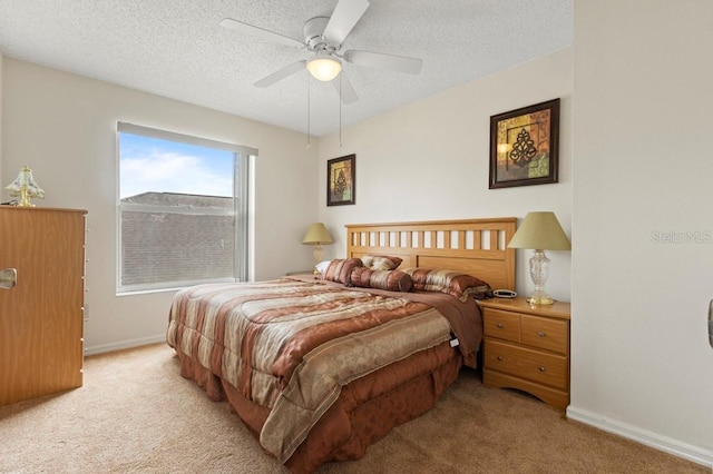 3018 Bransbury Ct, Kissimmee, FL 34747 - bedroom with light colored carpet, baseboards, a textured ceiling, and a ceiling fan