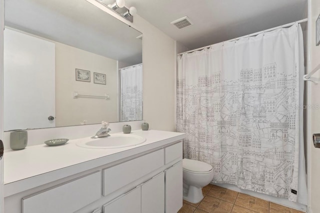 3018 Bransbury Ct, Kissimmee, FL 34747 - bathroom featuring toilet, vanity, and curtained shower