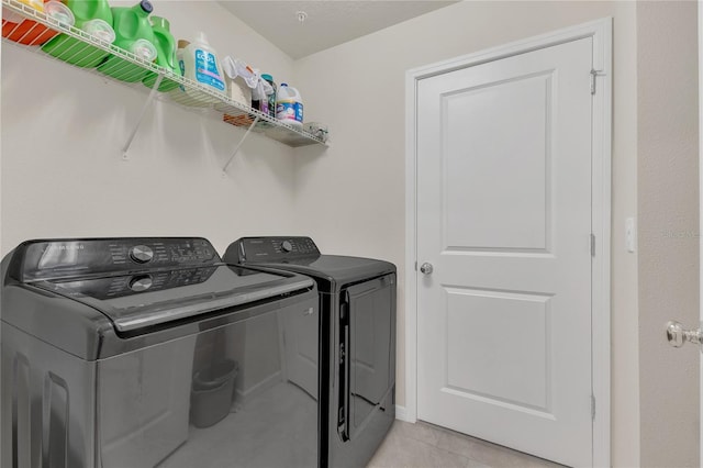 14335 Sapelo Beach Dr, Orlando, FL 32827 - washroom with independent washer and dryer and light tile patterned floors