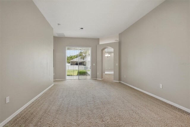 2674 Spicebush Loop, Apopka, FL 32712 - carpeted spare room with arched walkways and baseboards