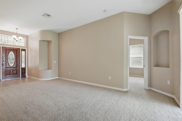 2674 Spicebush Loop, Apopka, FL 32712 - foyer featuring light colored carpet, a chandelier, and baseboards