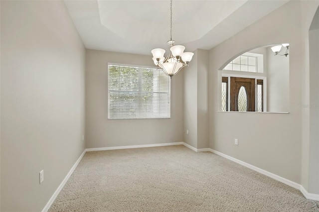 2674 Spicebush Loop, Apopka, FL 32712 - spare room with a chandelier, arched walkways, carpet flooring, and baseboards