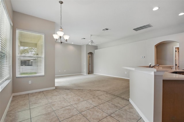 2674 Spicebush Loop, Apopka, FL 32712 - empty room featuring arched walkways, ceiling fan, light colored carpet, recessed lighting, and a sink
