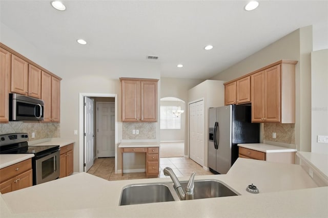 2674 Spicebush Loop, Apopka, FL 32712 - kitchen with appliances with stainless steel finishes, a sink, light tile patterned flooring, decorative backsplash, and recessed lighting