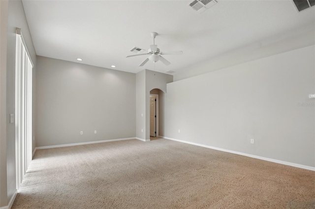 2674 Spicebush Loop, Apopka, FL 32712 - empty room with arched walkways, a ceiling fan, light colored carpet, baseboards, and recessed lighting