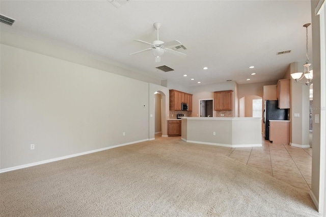 2674 Spicebush Loop, Apopka, FL 32712 - unfurnished living room featuring arched walkways, ceiling fan, light colored carpet, recessed lighting, and baseboards
