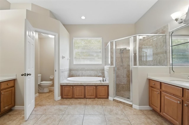 2674 Spicebush Loop, Apopka, FL 32712 - bathroom with vanity, toilet, a bath, a stall shower, and recessed lighting