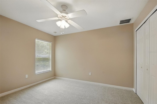 2674 Spicebush Loop, Apopka, FL 32712 - unfurnished bedroom with carpet flooring, a closet, baseboards, and ceiling fan