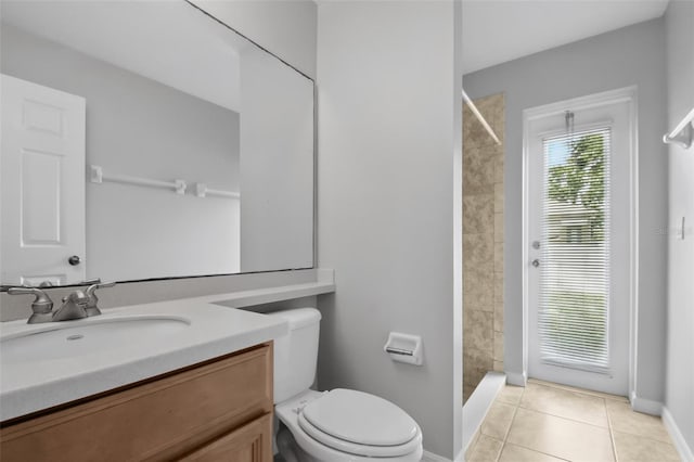 2674 Spicebush Loop, Apopka, FL 32712 - full bath with toilet, vanity, tiled shower, baseboards, and tile patterned flooring
