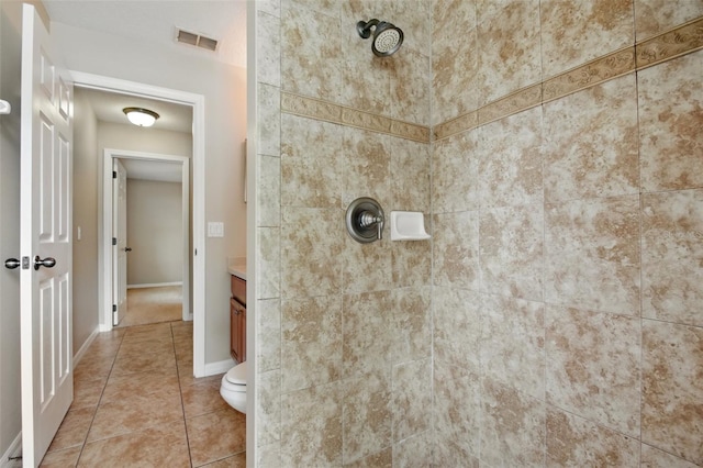 2674 Spicebush Loop, Apopka, FL 32712 - full bathroom featuring a tile shower, tile patterned flooring, vanity, and toilet