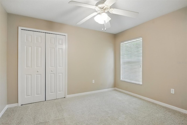 2674 Spicebush Loop, Apopka, FL 32712 - unfurnished bedroom with carpet, a closet, baseboards, and ceiling fan