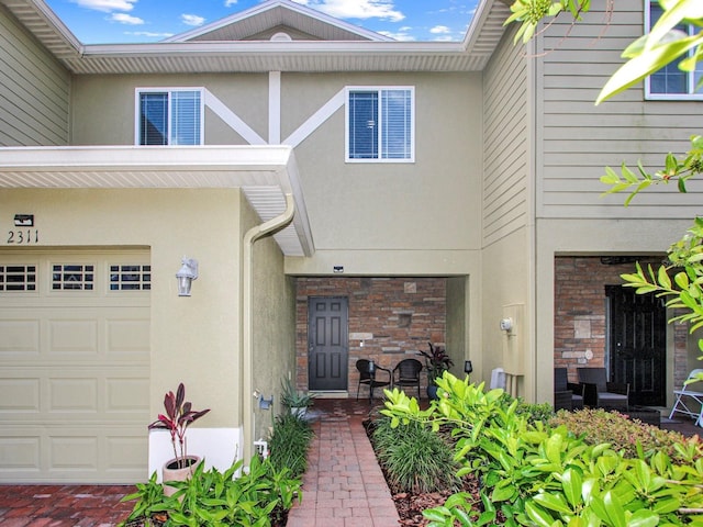 2311 Chatham Place Dr, Orlando, FL 32824 - view of exterior entry with stucco siding and stone siding