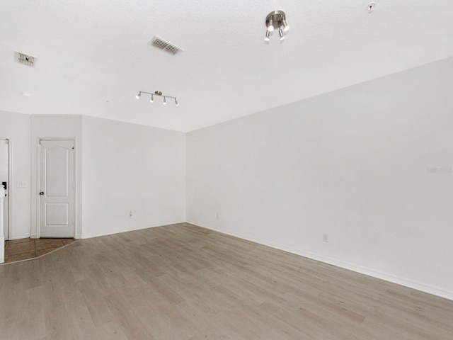 2311 Chatham Place Dr, Orlando, FL 32824 - spare room with light wood finished floors and baseboards