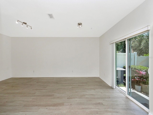 2311 Chatham Place Dr, Orlando, FL 32824 - spare room with light wood-style floors and baseboards