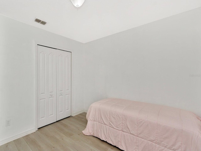 2311 Chatham Place Dr, Orlando, FL 32824 - bedroom featuring light wood finished floors and a closet