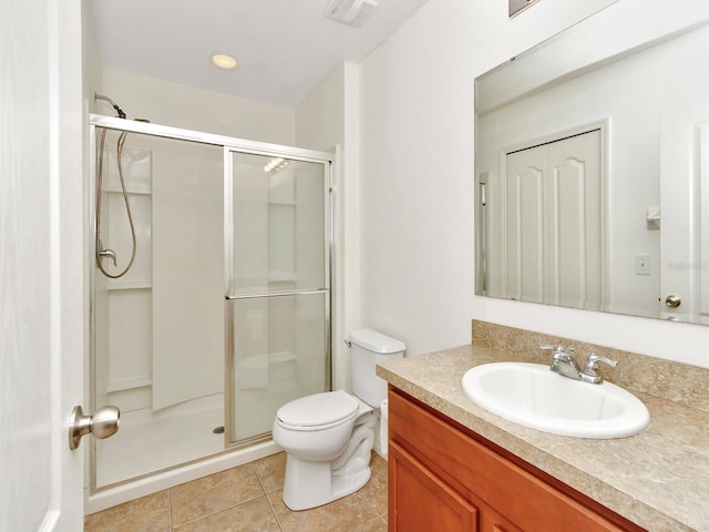 2311 Chatham Place Dr, Orlando, FL 32824 - full bathroom featuring vanity, a stall shower, toilet, and tile patterned floors