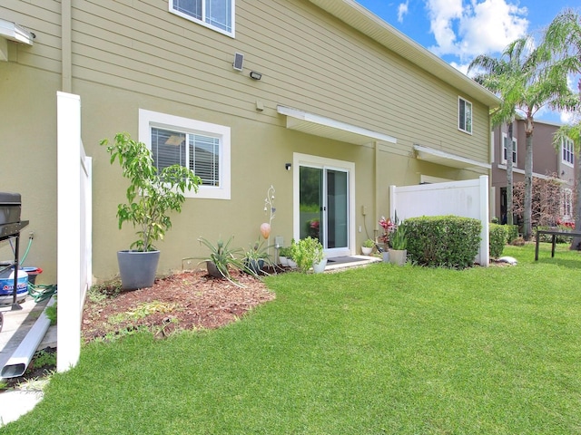 2311 Chatham Place Dr, Orlando, FL 32824 - back of house featuring stucco siding