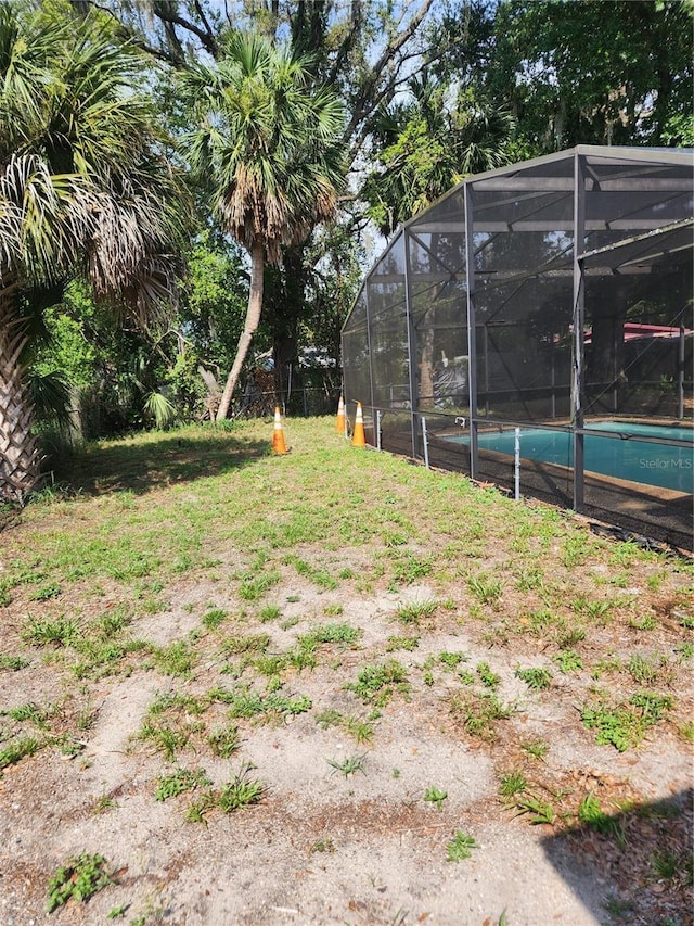 1245 Emeralda, Orlando, FL 32808 - view of yard with an outdoor pool and a lanai