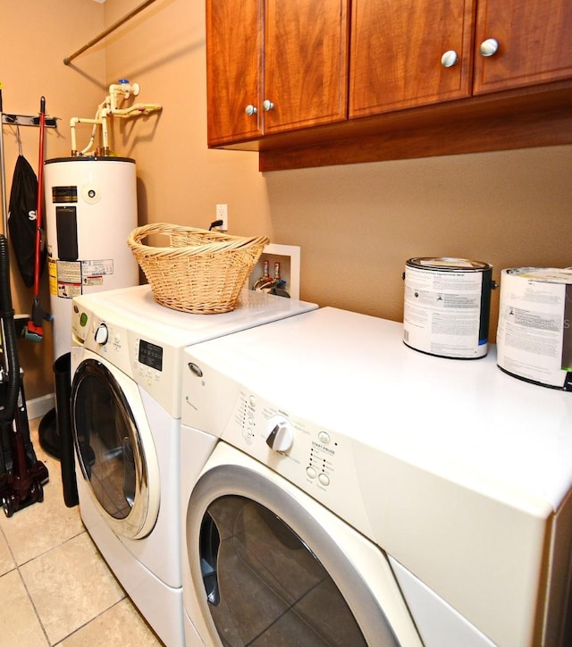 630 Vassar St Unit 2508, Orlando, FL 32804 - laundry room with cabinet space, separate washer and dryer, light tile patterned floors, and water heater