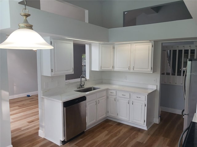 2181 Wekiwa Oaks Dr, Apopka, FL 32703 - kitchen featuring stainless steel appliances, a sink, white cabinets, and dark wood finished floors