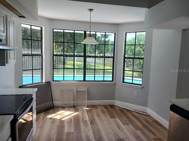 2181 Wekiwa Oaks Dr, Apopka, FL 32703 - unfurnished dining area with baseboards and light wood-type flooring