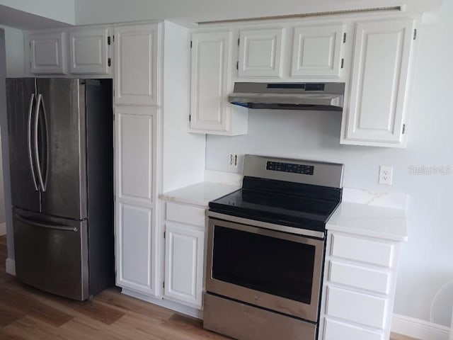 2181 Wekiwa Oaks Dr, Apopka, FL 32703 - kitchen featuring stainless steel appliances, under cabinet range hood, light wood finished floors, white cabinetry, and light stone countertops