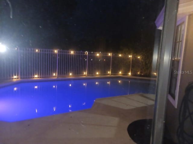 2181 Wekiwa Oaks Dr, Apopka, FL 32703 - view of pool at twilight