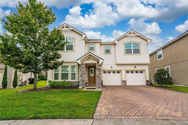 4952 Longmeadow Park St, Orlando, FL 32811 - view of property featuring stucco siding, decorative driveway, stone siding, and an attached garage