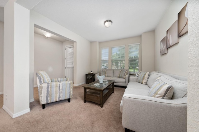 4952 Longmeadow Park St, Orlando, FL 32811 - living room with light carpet and baseboards