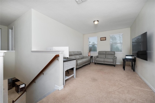 4952 Longmeadow Park St, Orlando, FL 32811 - carpeted living area featuring baseboards and a textured ceiling