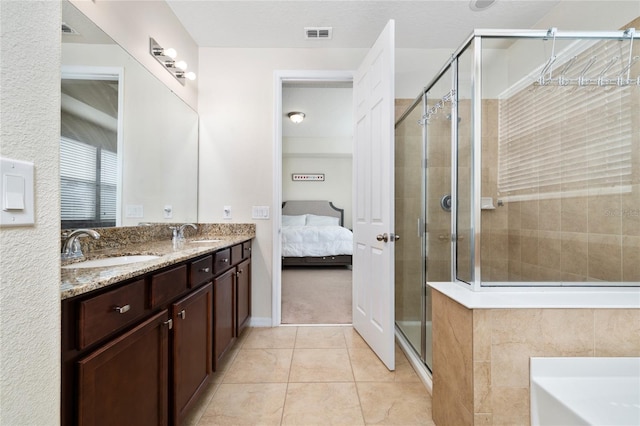 4952 Longmeadow Park St, Orlando, FL 32811 - ensuite bathroom with a shower stall, double vanity, a garden tub, and tile patterned flooring
