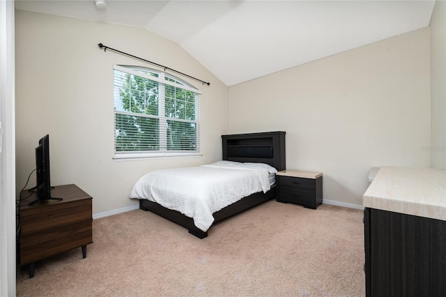 4952 Longmeadow Park St, Orlando, FL 32811 - bedroom featuring light carpet, vaulted ceiling, and baseboards