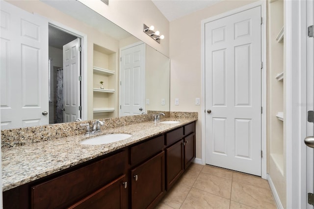 4952 Longmeadow Park St, Orlando, FL 32811 - bathroom featuring double vanity, tile patterned flooring, baseboards, and a shower with curtain