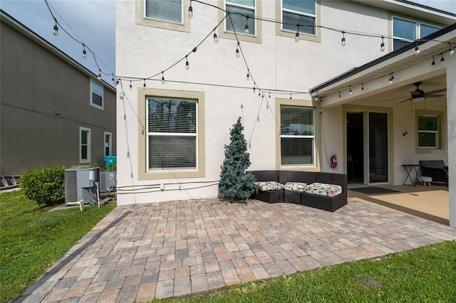 4952 Longmeadow Park St, Orlando, FL 32811 - back of house with a ceiling fan, a patio area, central AC, and stucco siding
