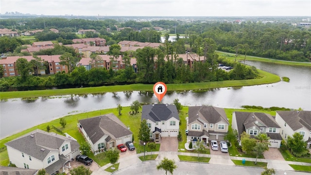 4952 Longmeadow Park St, Orlando, FL 32811 - aerial view of residential area with a large body of water