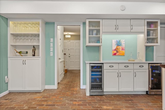 1135 Thunder Trl, Maitland, FL 32751 - kitchen with wine cooler, baseboards, and brick floors
