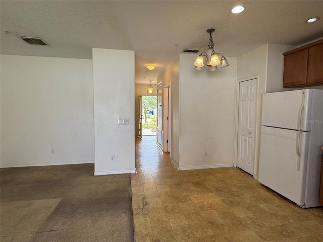 2018 Cypress Bay Blvd, Kissimmee, FL 34743 - kitchen with freestanding refrigerator, a chandelier, baseboards, recessed lighting, and decorative light fixtures