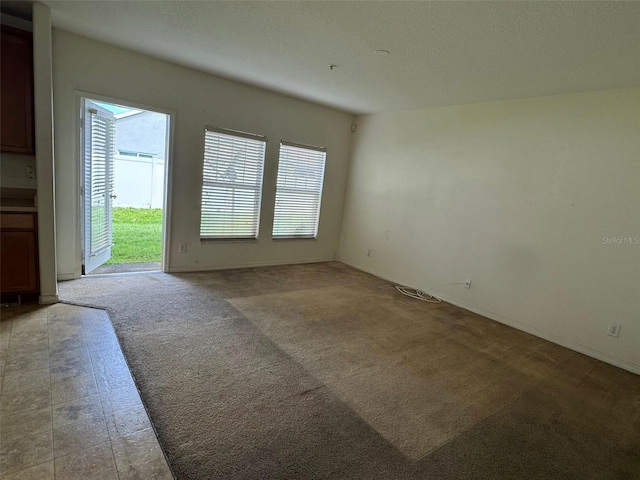 2018 Cypress Bay Blvd, Kissimmee, FL 34743 - unfurnished room featuring healthy amount of natural light and light colored carpet